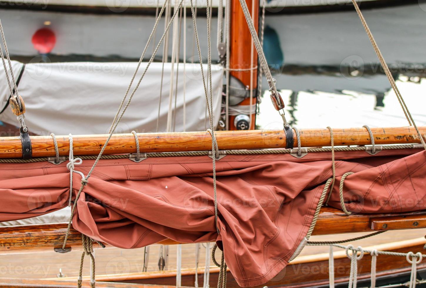 Detailed close up detail of ropes and cordage in the rigging of an old wooden vintage sailboat photo