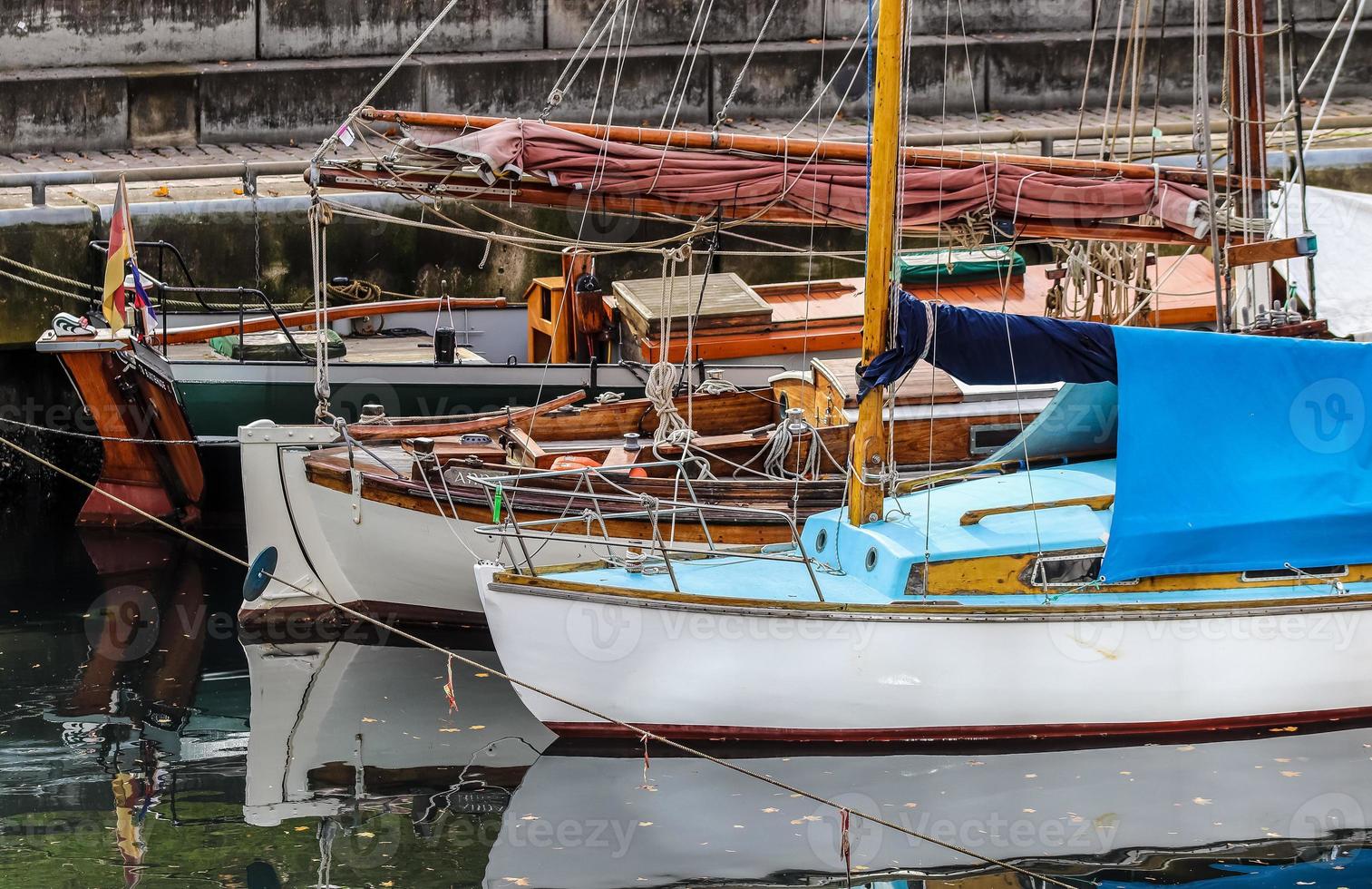 Detailed close up detail of ropes and cordage in the rigging of an old wooden vintage sailboat photo