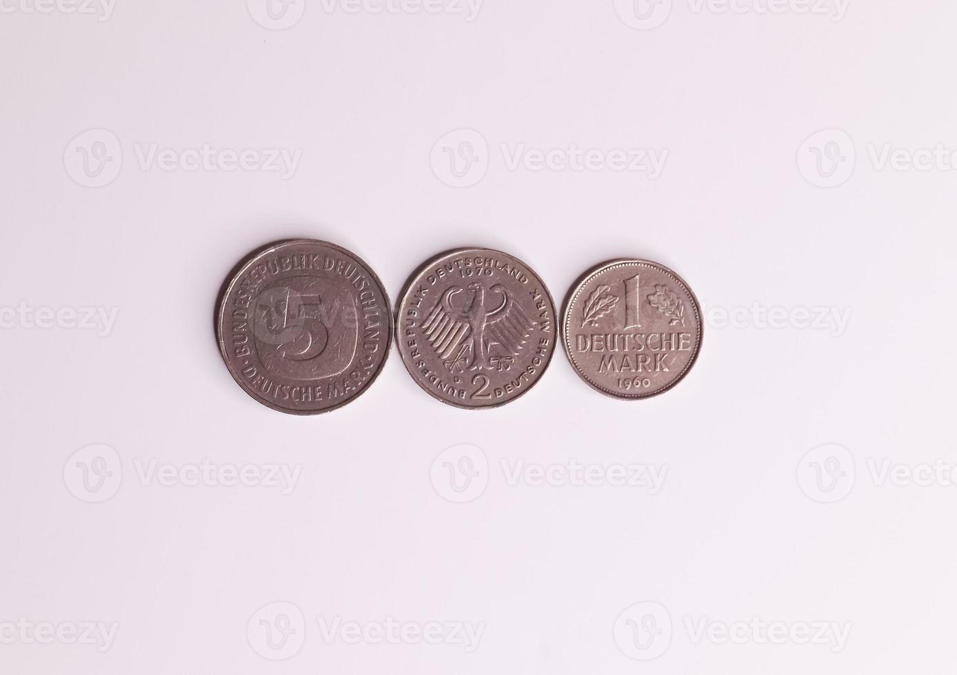 Several coins of the no longer current currency Deutsche Mark from Germany. photo
