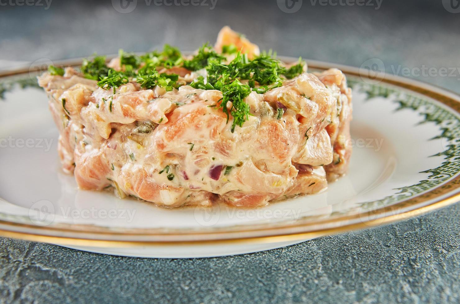 Amazing fresh and smoked salmon tartare. French gourmet food photo