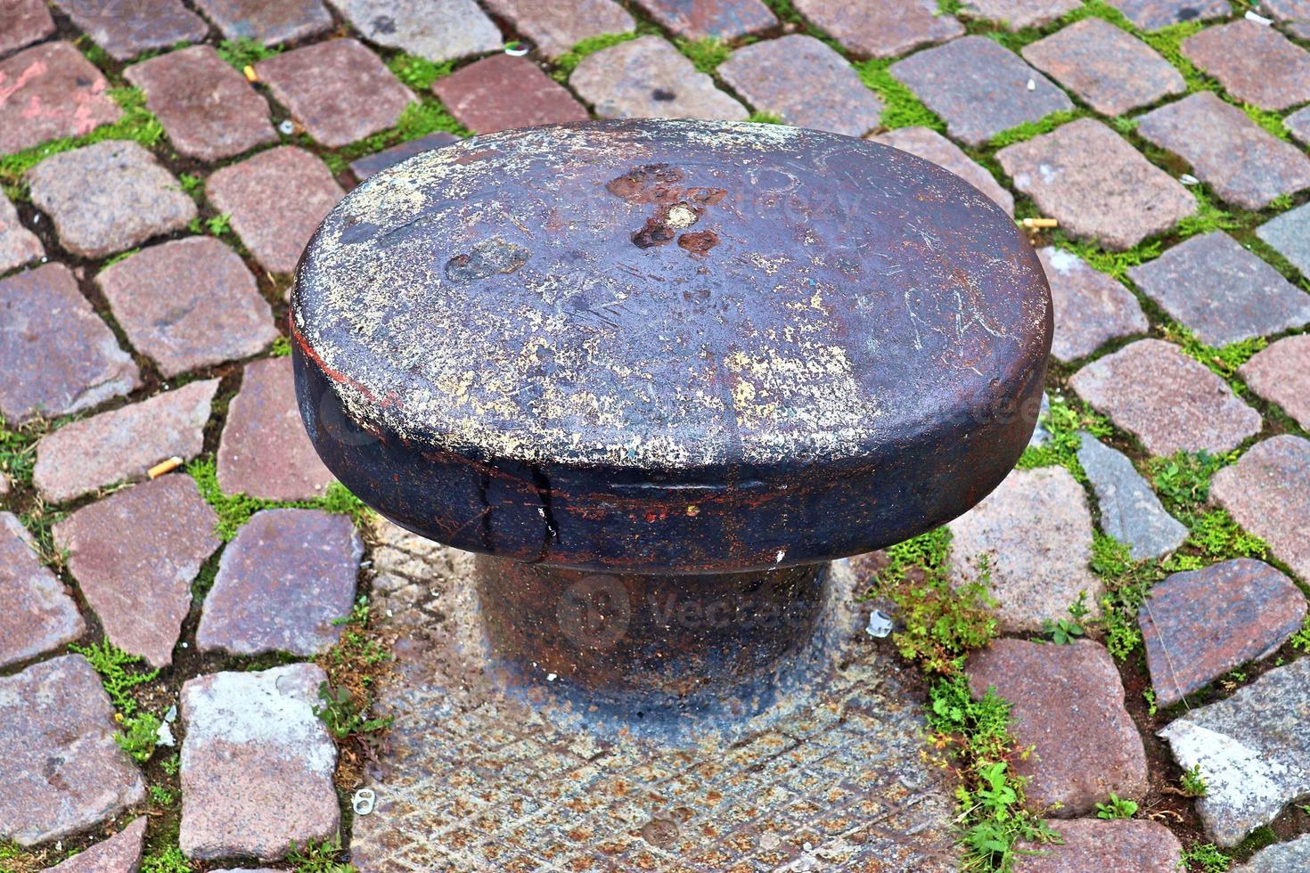 Different bollards and technical installations of vessel traffic at a port photo