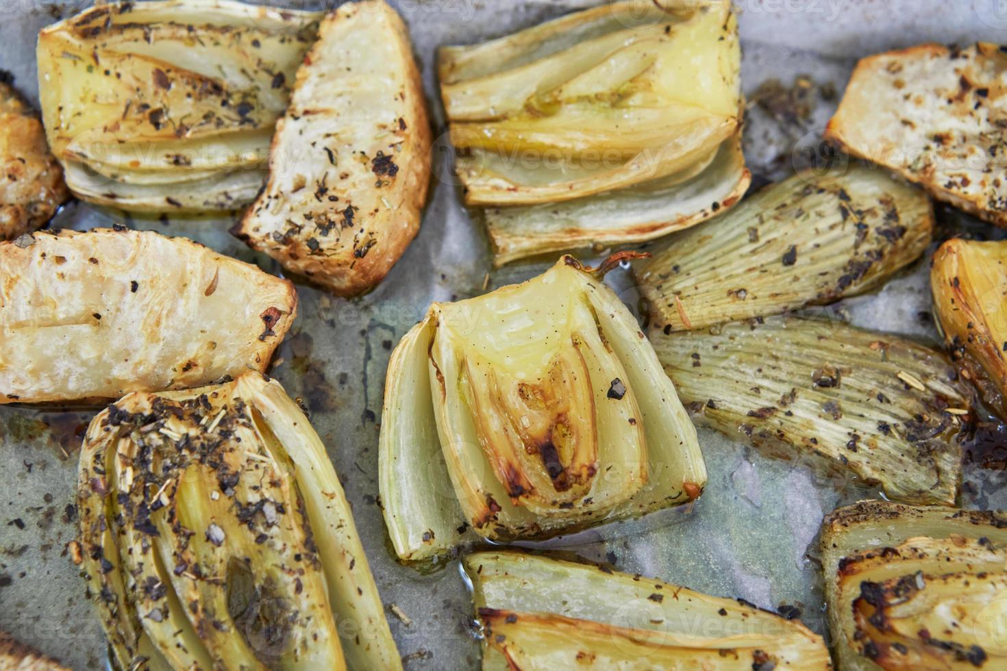 Stewed chicory on sheet in an electric stove after baking, according to recipe from the Internet photo