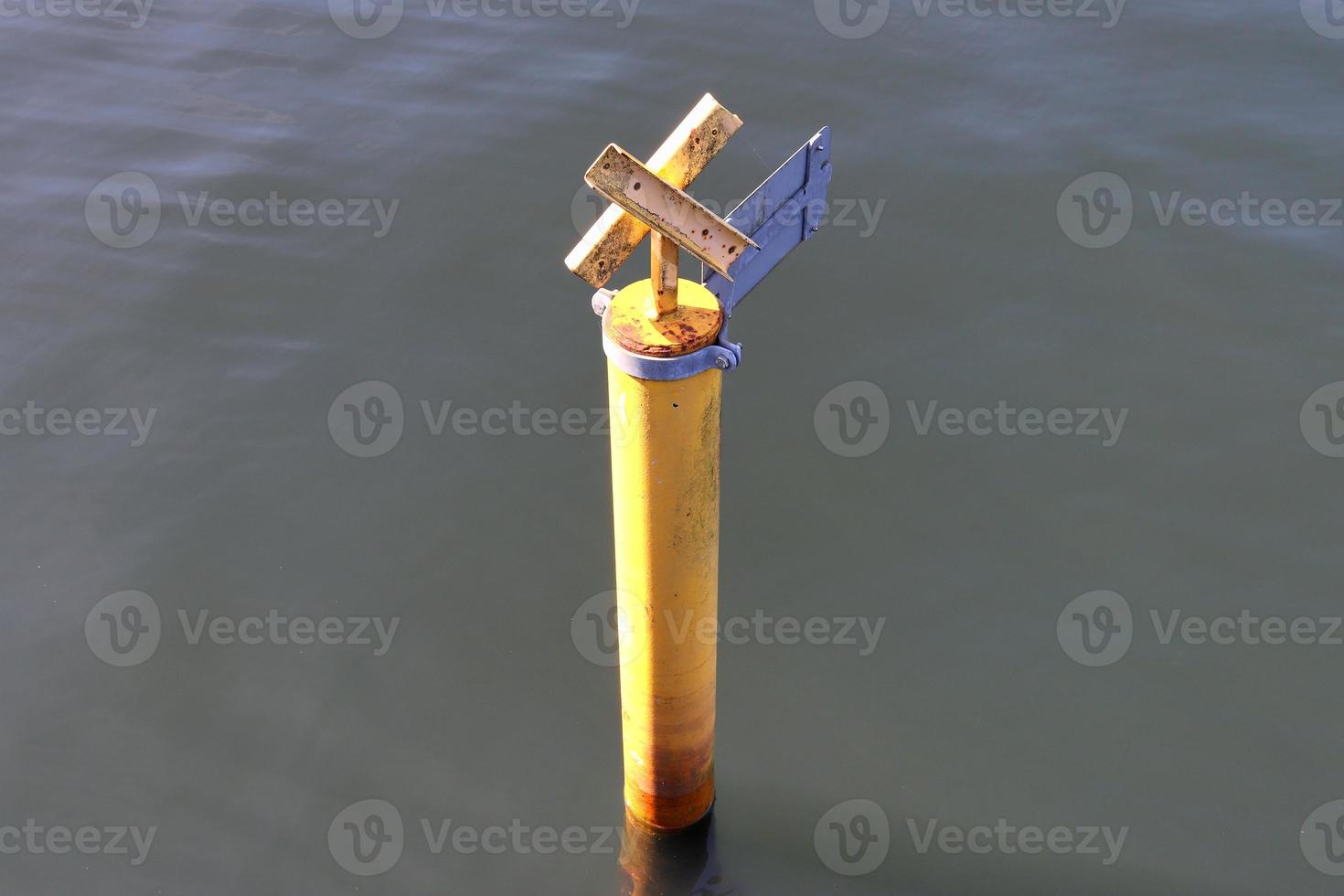 Different bollards and technical installations of vessel traffic at a port photo