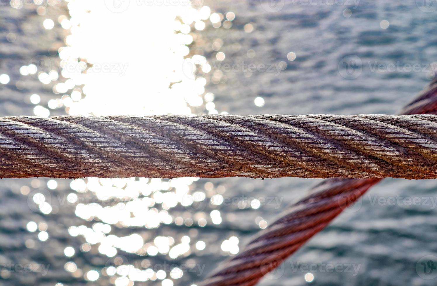 Detailed close up detail of ropes and cordage in the rigging of an old wooden vintage sailboat photo