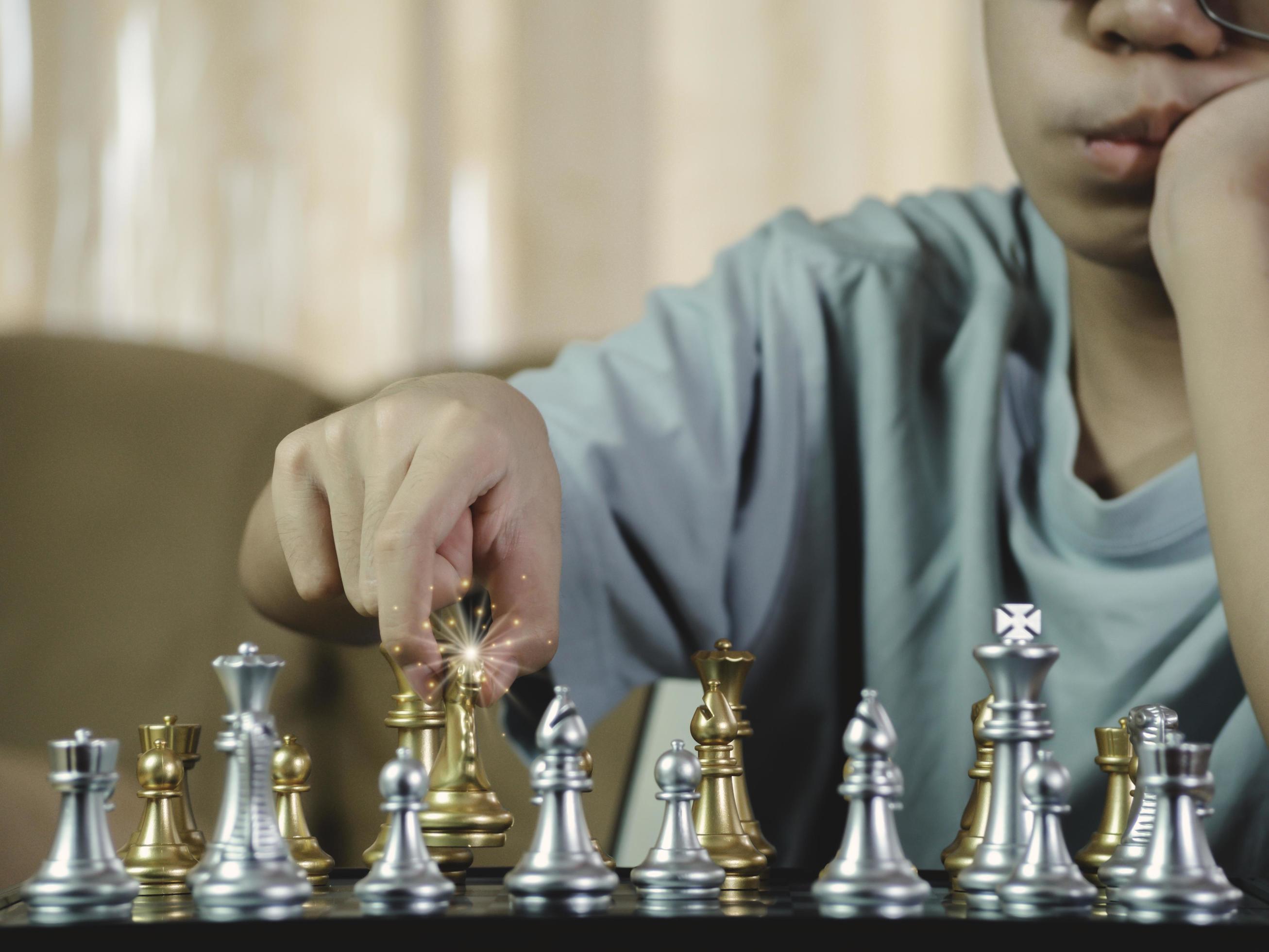 Concentrated serious boy developing chess gambit, strategy ,playing board  game to winner clever concentration and thinking child while playing chess.  Learning, tactics and analysis concept. 7292813 Stock Photo at Vecteezy