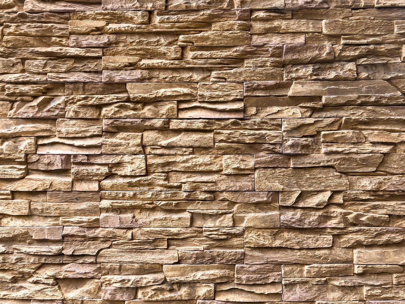 Classic Random Light brown brick arranged on the wall for decorate exterior of building. photo