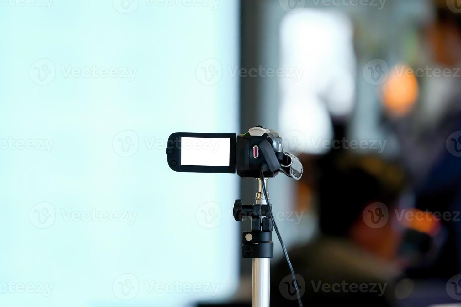 Amature and none professional video recorder static to record speaker in small seminar at conference room. photo