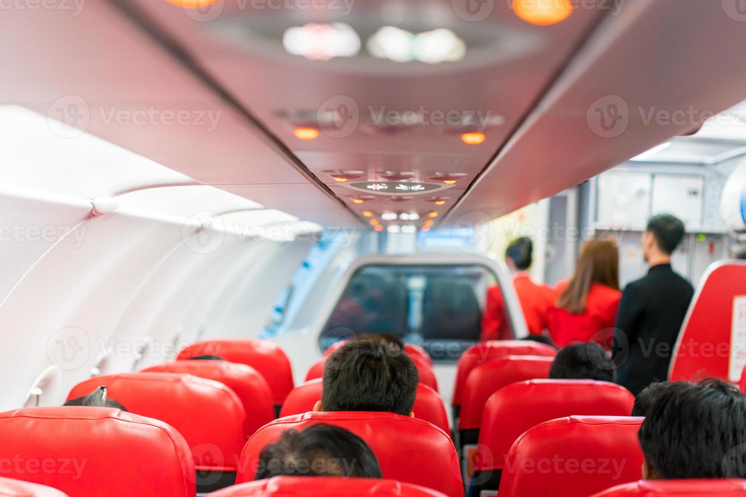closeup airplane Console panel lamp, light, need help button, air condition, sefty belt and no smoking lighting sign. photo
