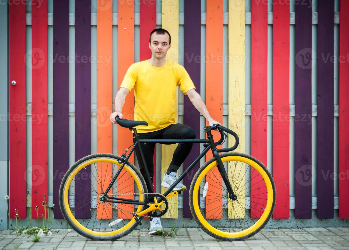 Portrait of a young man with a Bicycle. photo