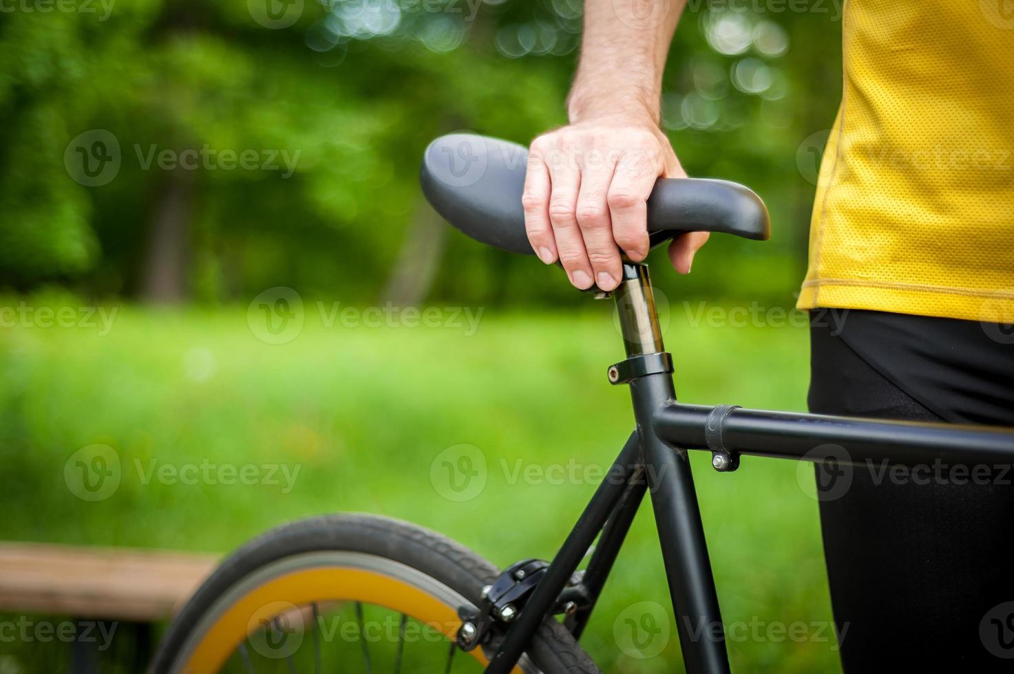 Cyclist with his bike, close up. Outdoor photography. photo