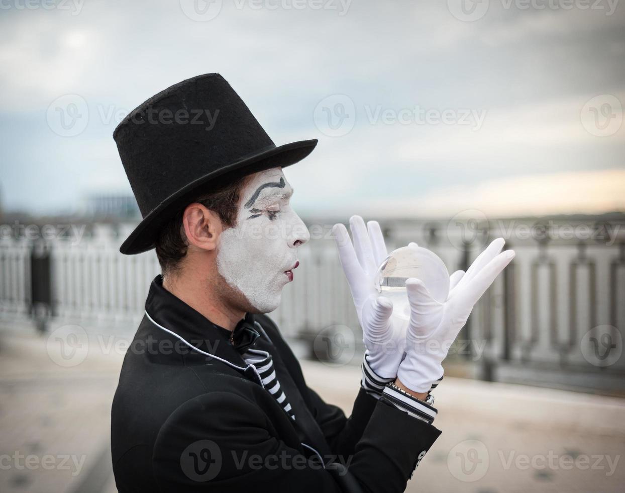 Mime on the street waiting to meet with his lover photo