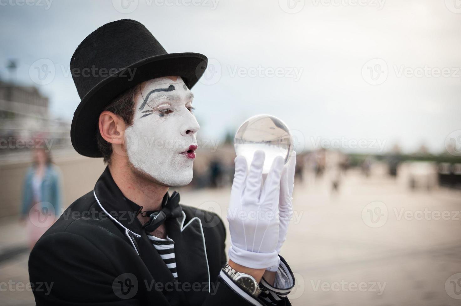 Mime on the street waiting to meet with his lover photo