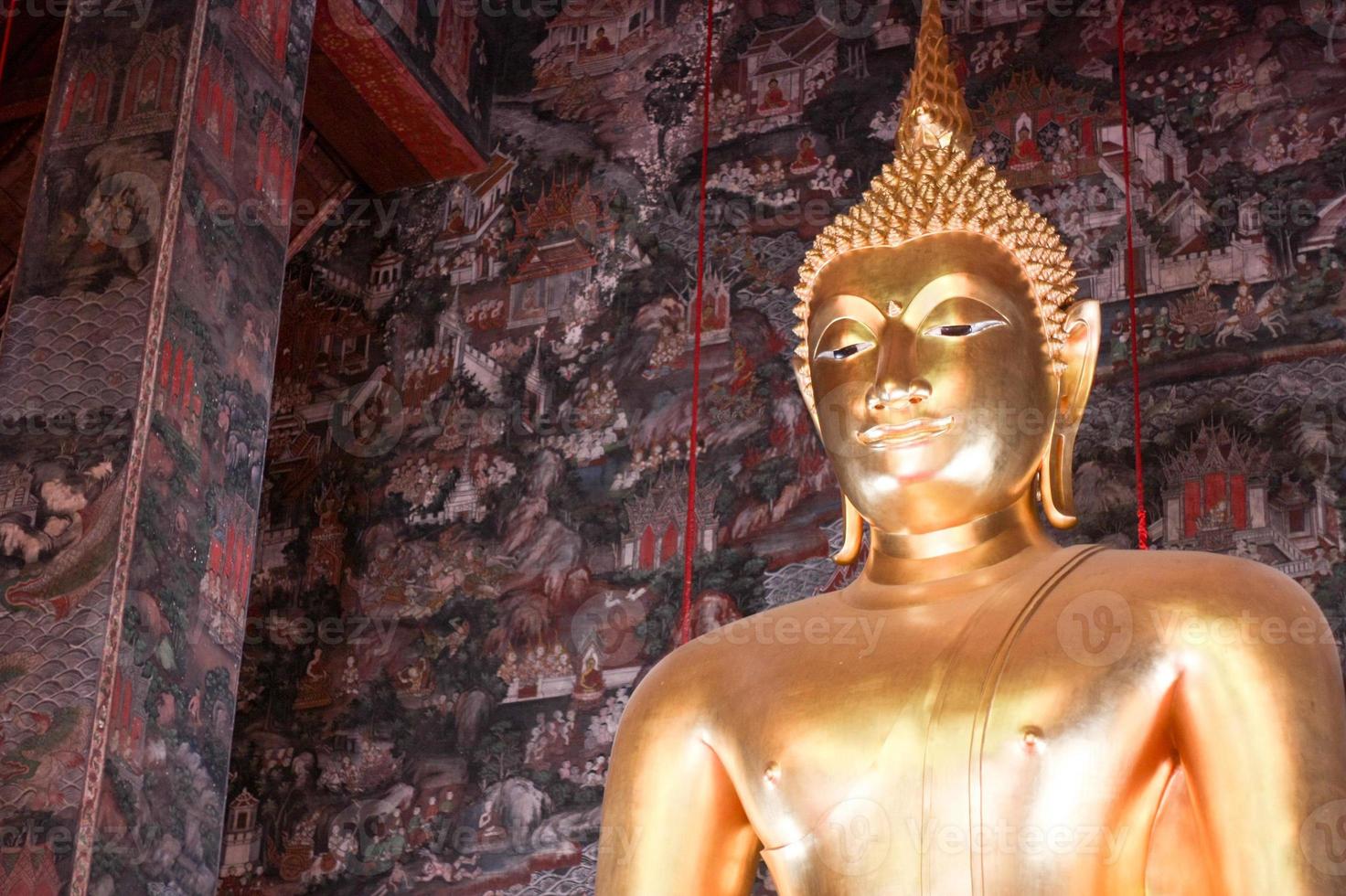 Giant golden Buddha statue front Thai acient art living style in Buddhist temple., Bangkok, Thailand photo