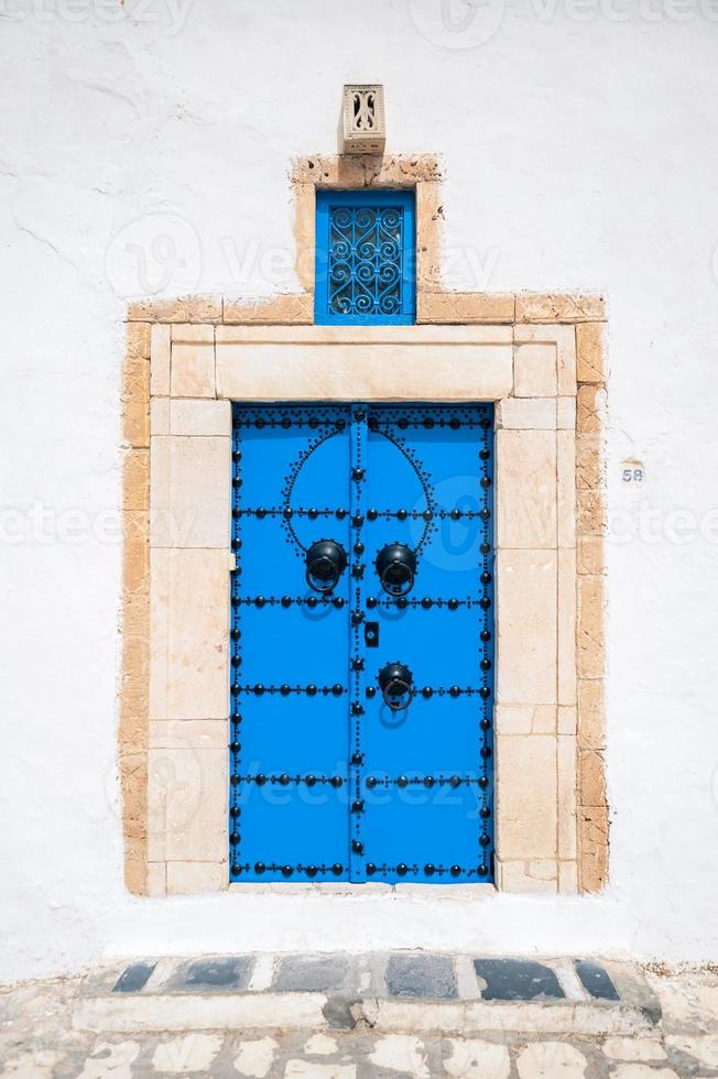 Old, elegant entrance to the house. Tunisian doors photo