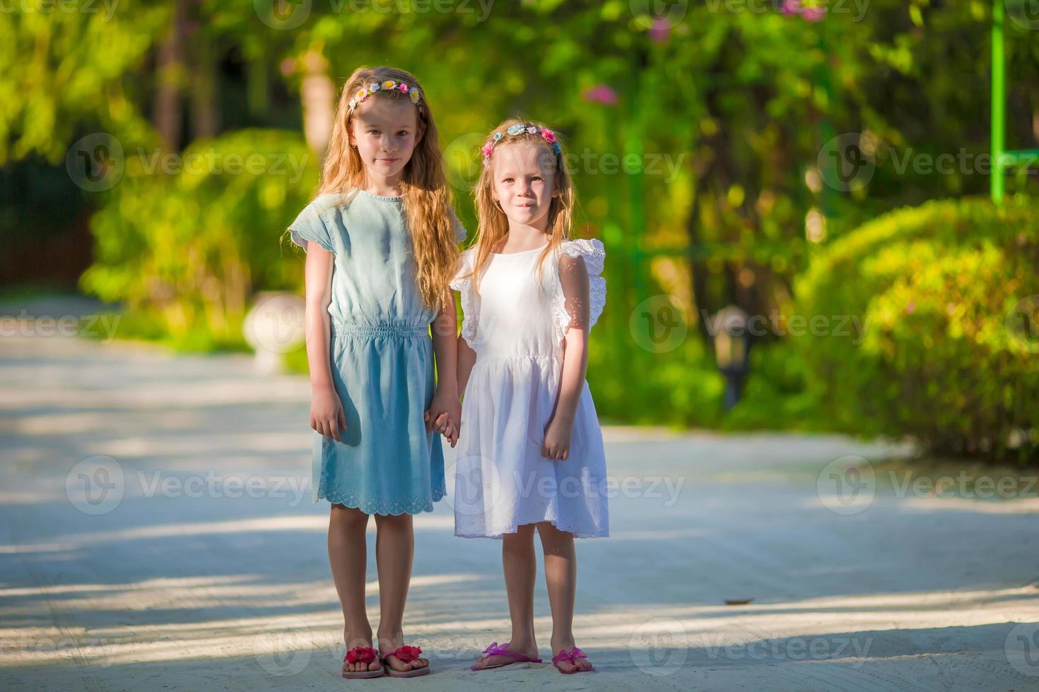 Adorable little girls during summer vacation photo