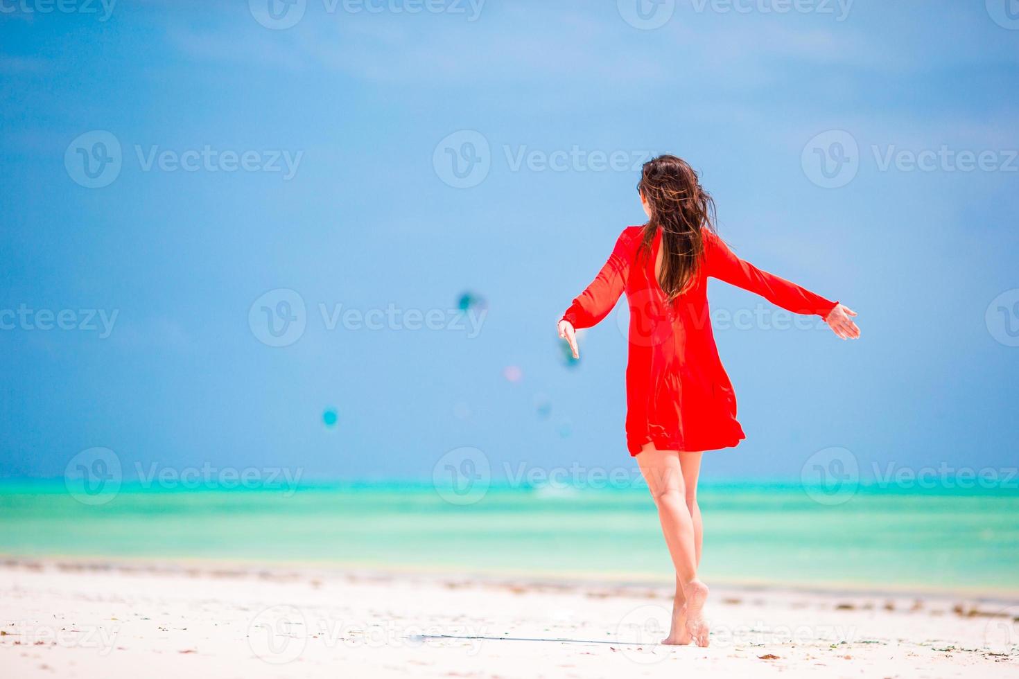 Young beautiful woman during tropical beach vacation photo