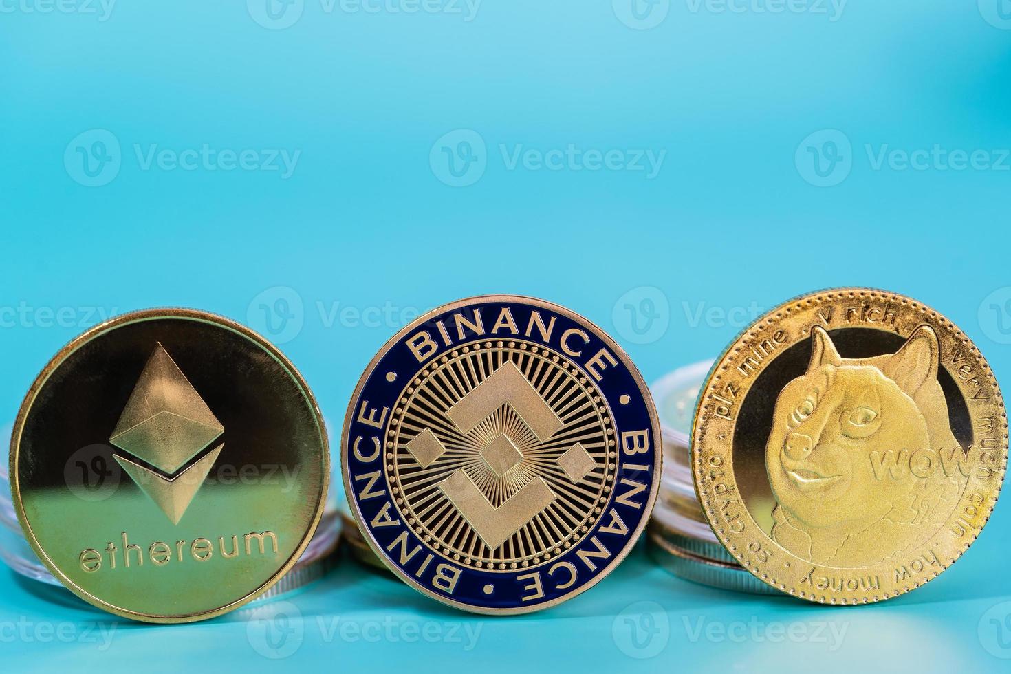 Ethereum ETH, Binance Coin BNB, Dogecoin DOGE group included with Crypto currency coin symbol Virtual blockchain technology future is money blue background close up and Macro concept. photo