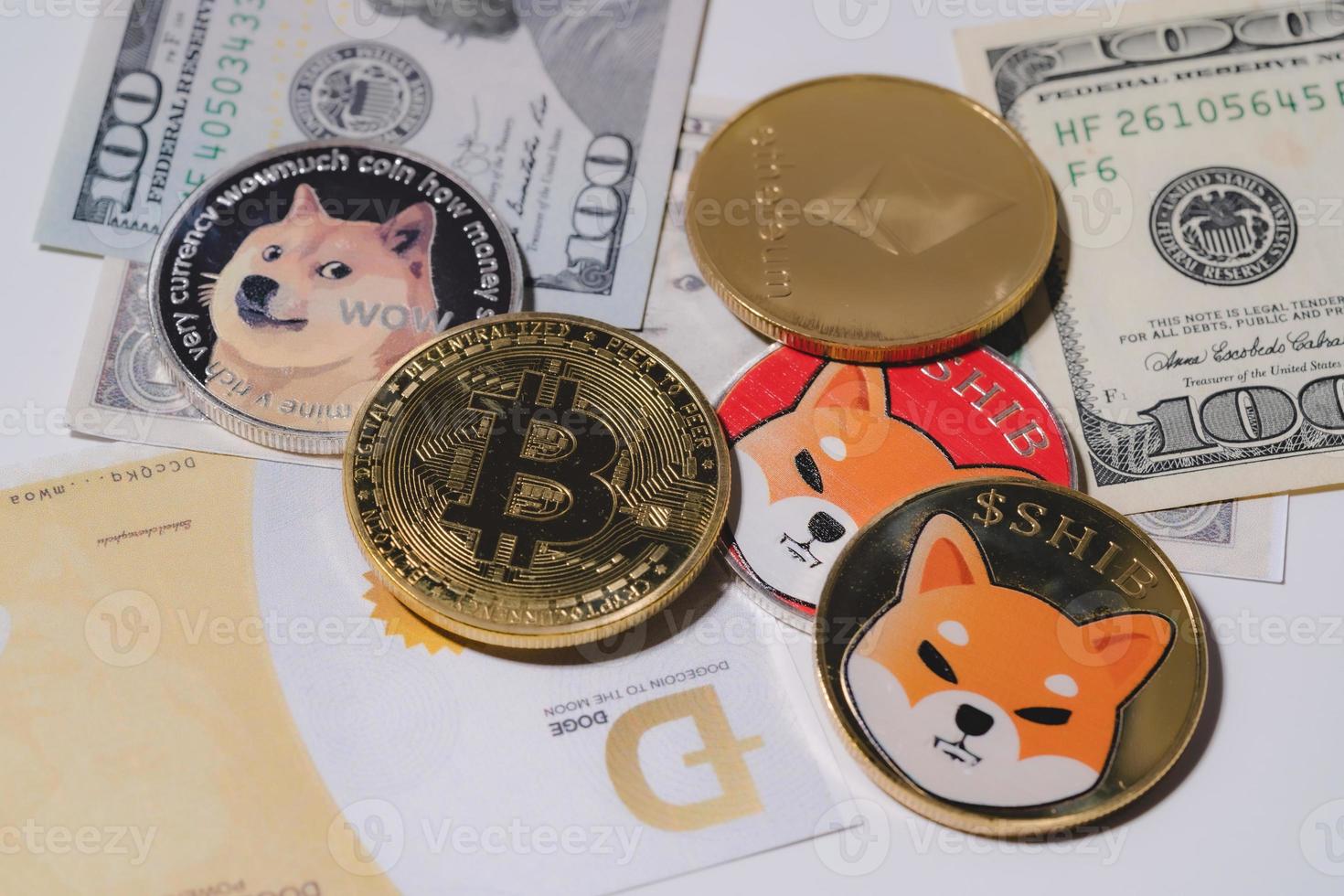 Dogecoin DOGE, bitcoin, Ethereum ETH, Shiba Coin, included with Crypto currency coin  on stack 100 hundred new US dollar Money American Virtual blockchain technology future is money Close up concept photo