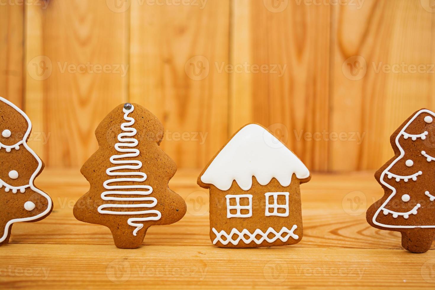 Christmas gingerbread cookies on wooden background photo