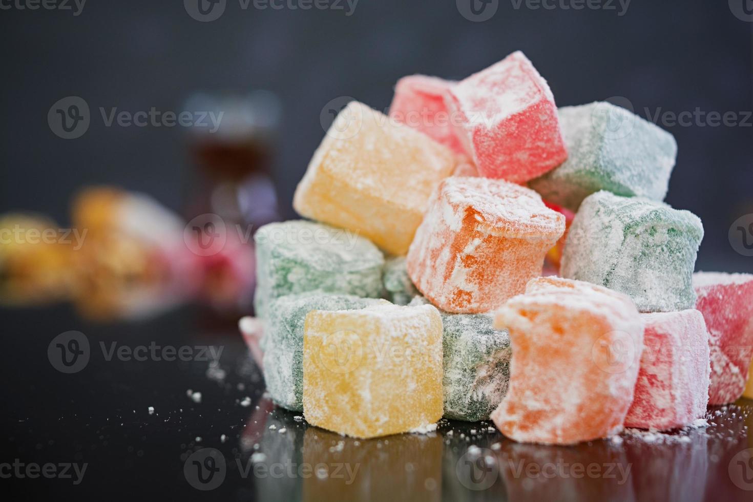 Turkish delights lokum on dark background photo