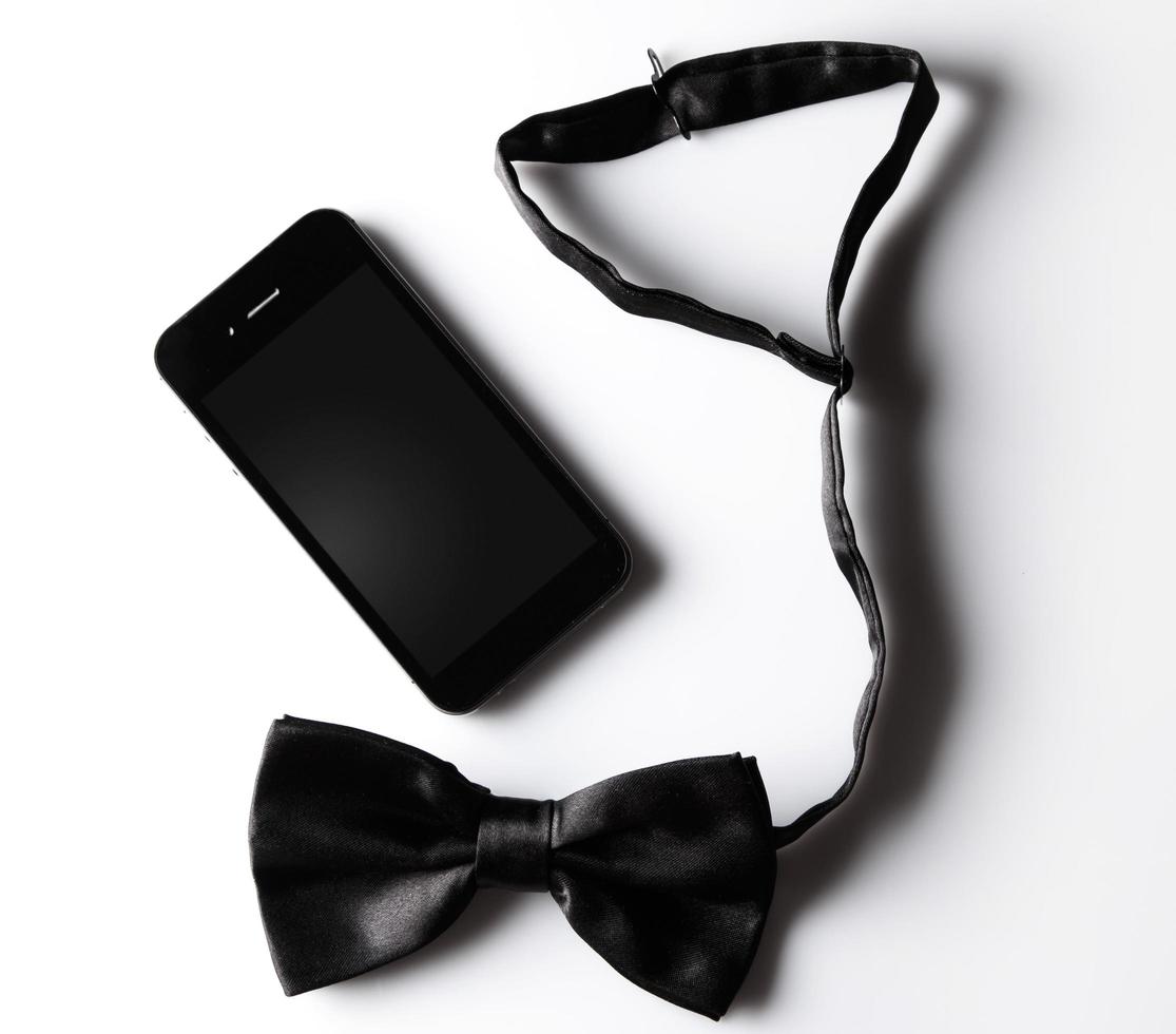 Black bowtie and smartphone photo