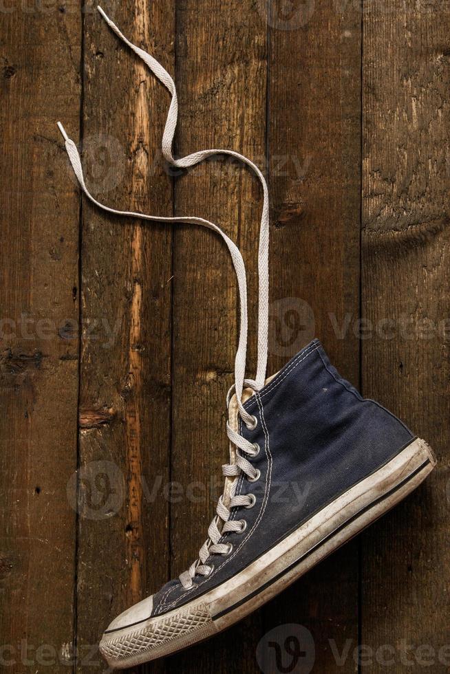 Gumshoe on wooden background photo