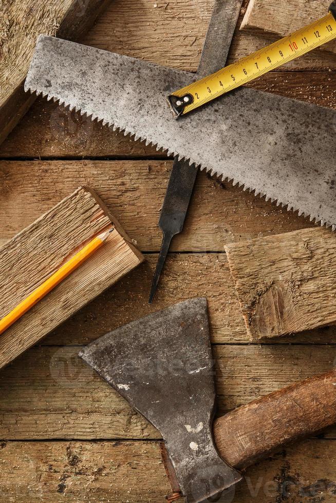 Carpentry tools on wooden surface photo