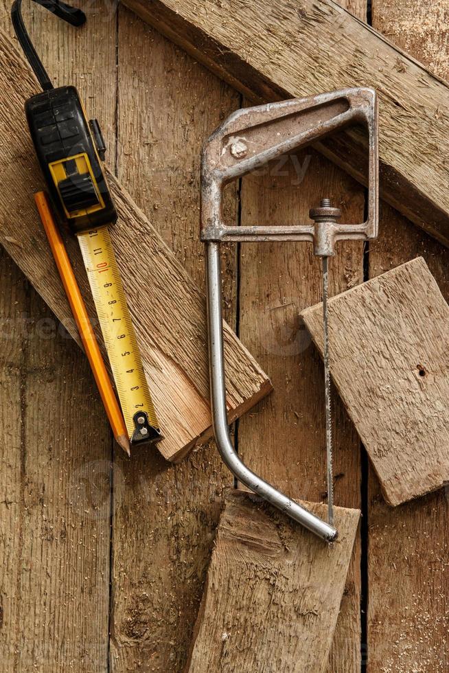 Carpentry tools on wooden surface photo