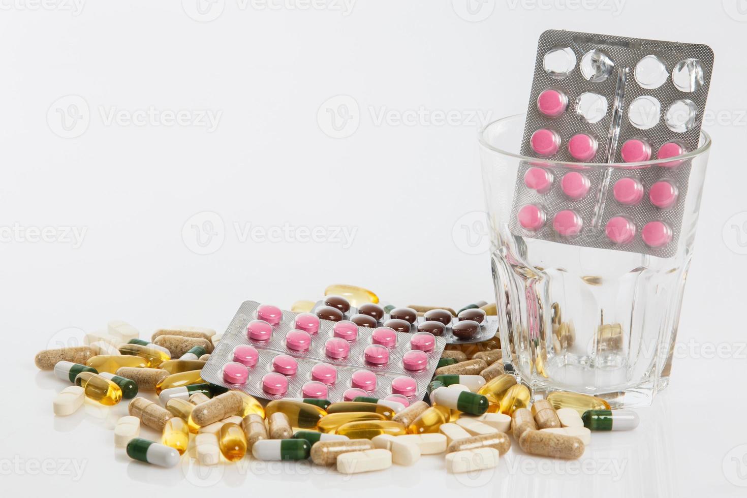 Glass and different pills photo