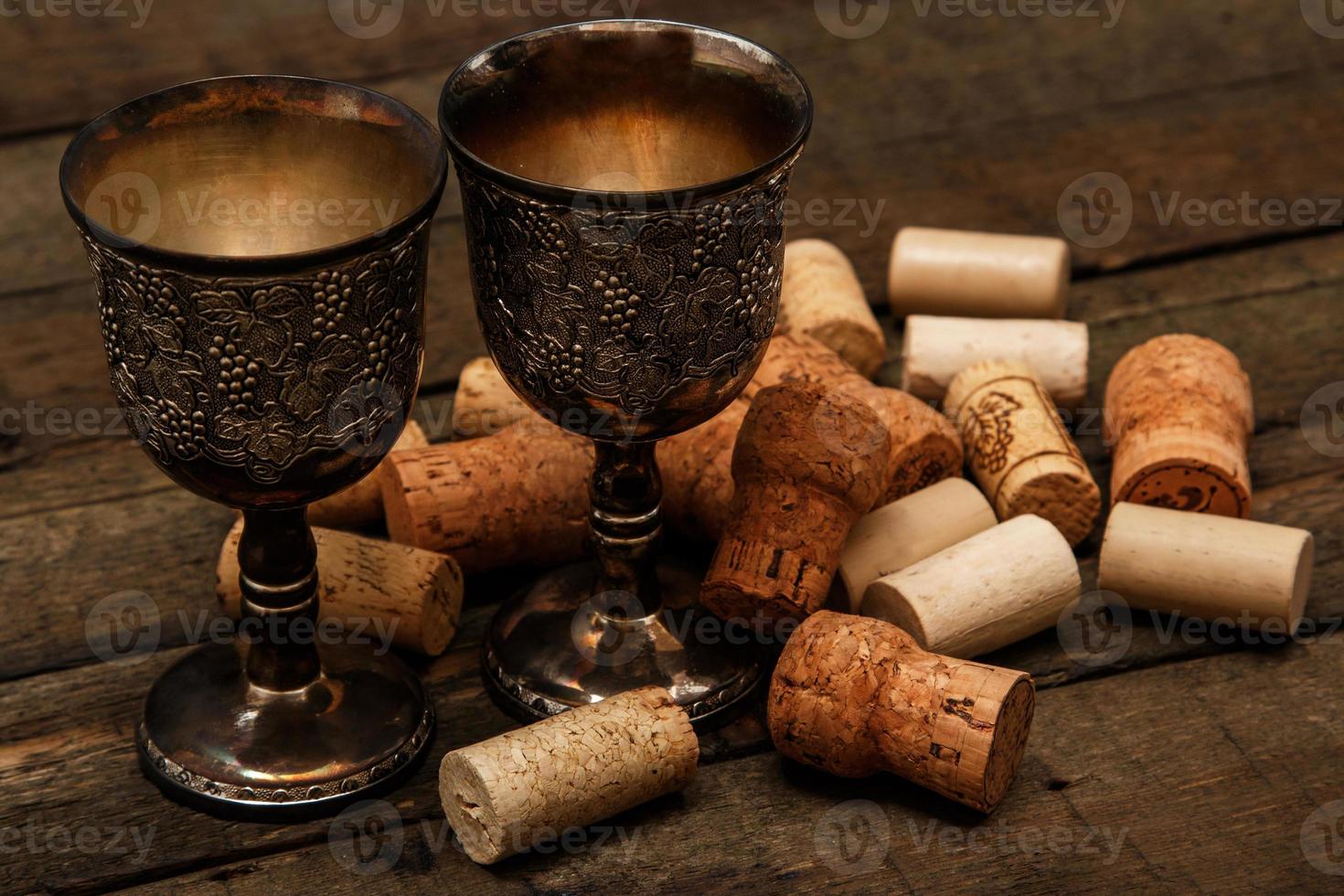 Medieval goblets and wine corks photo