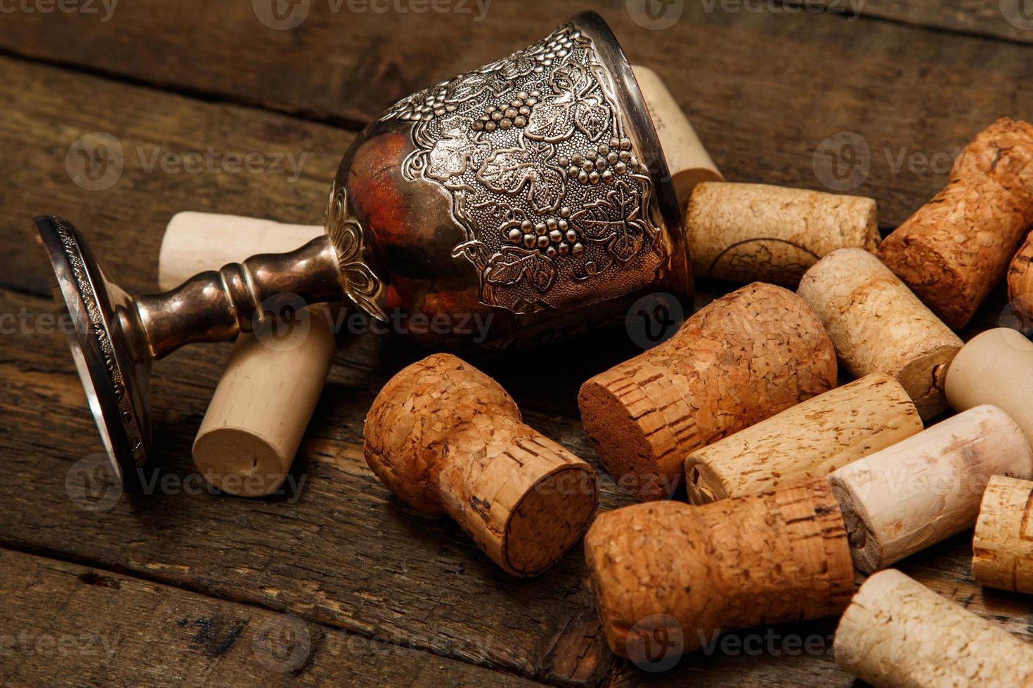 Medieval goblet and wine corks photo