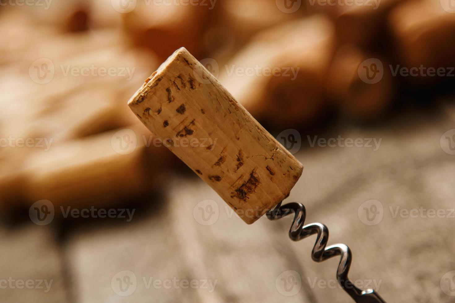Corkscrew and wine corks photo