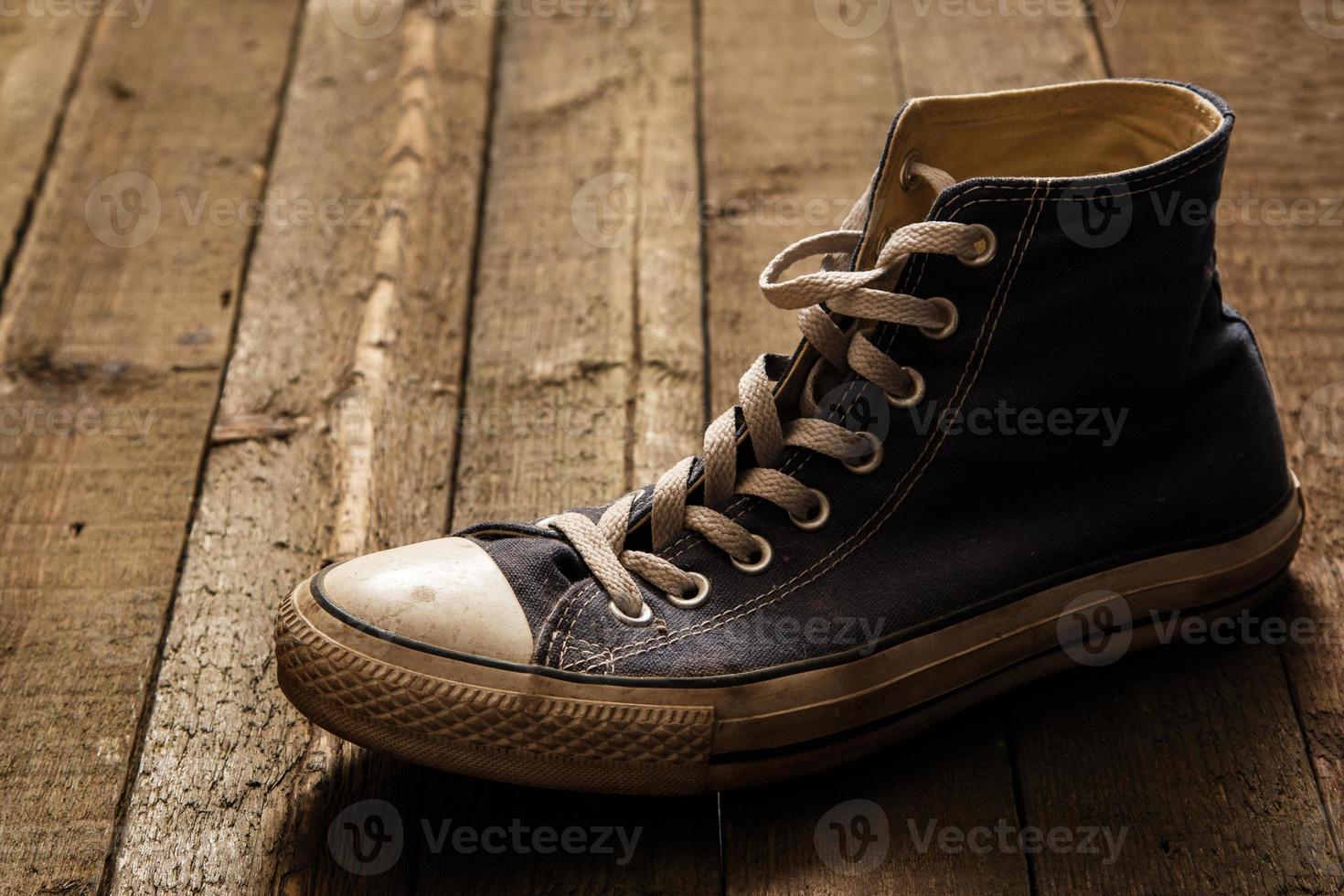 Gumshoe on wooden background photo