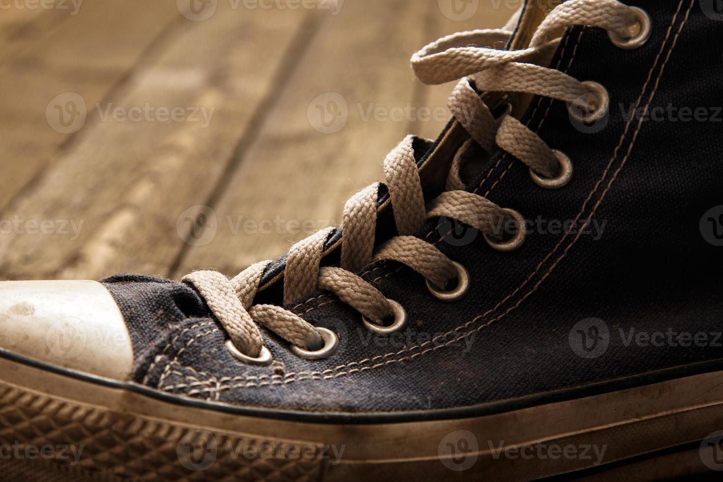 Gumshoe on wooden background photo