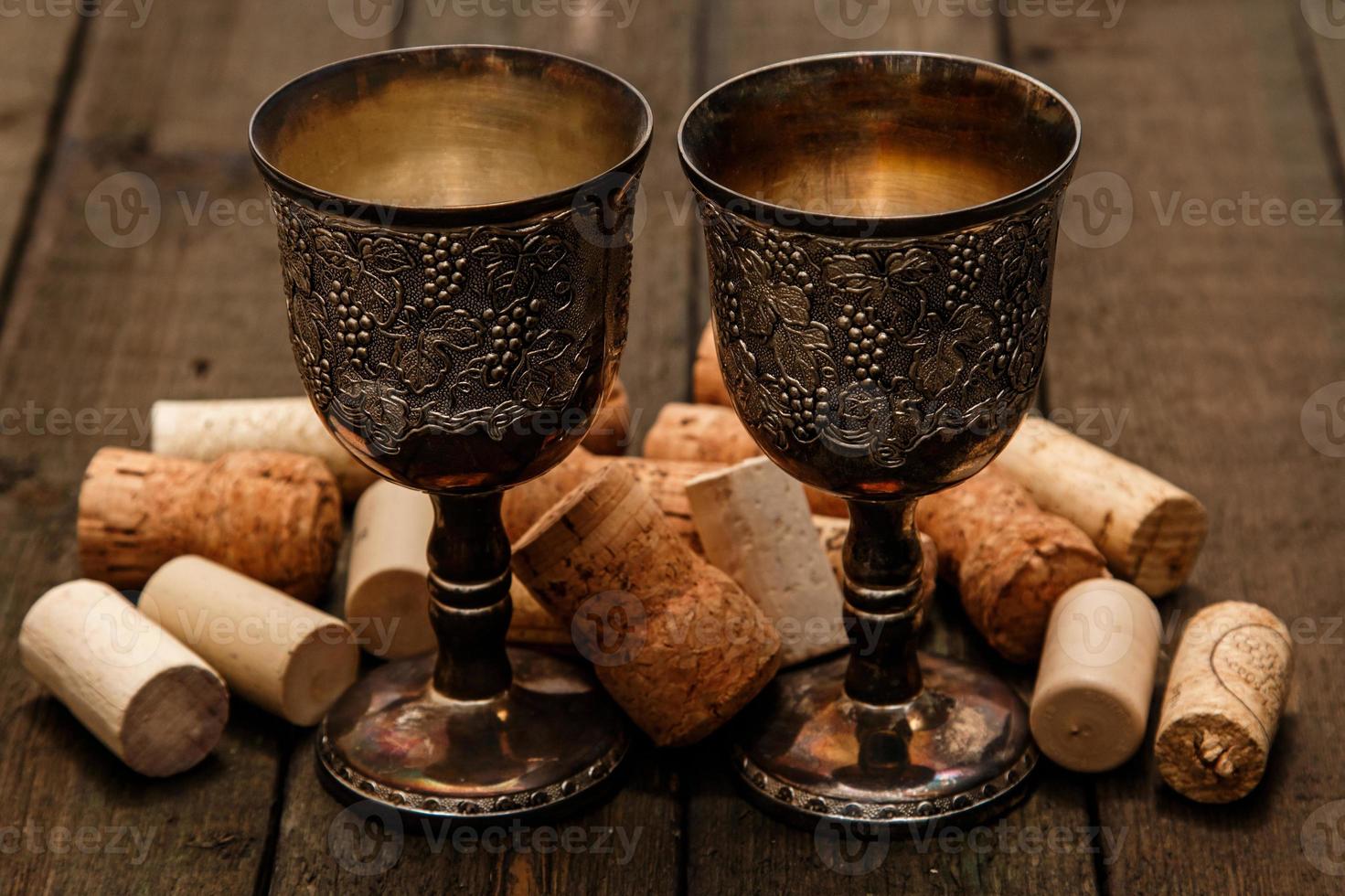 Medieval goblets and wine corks photo