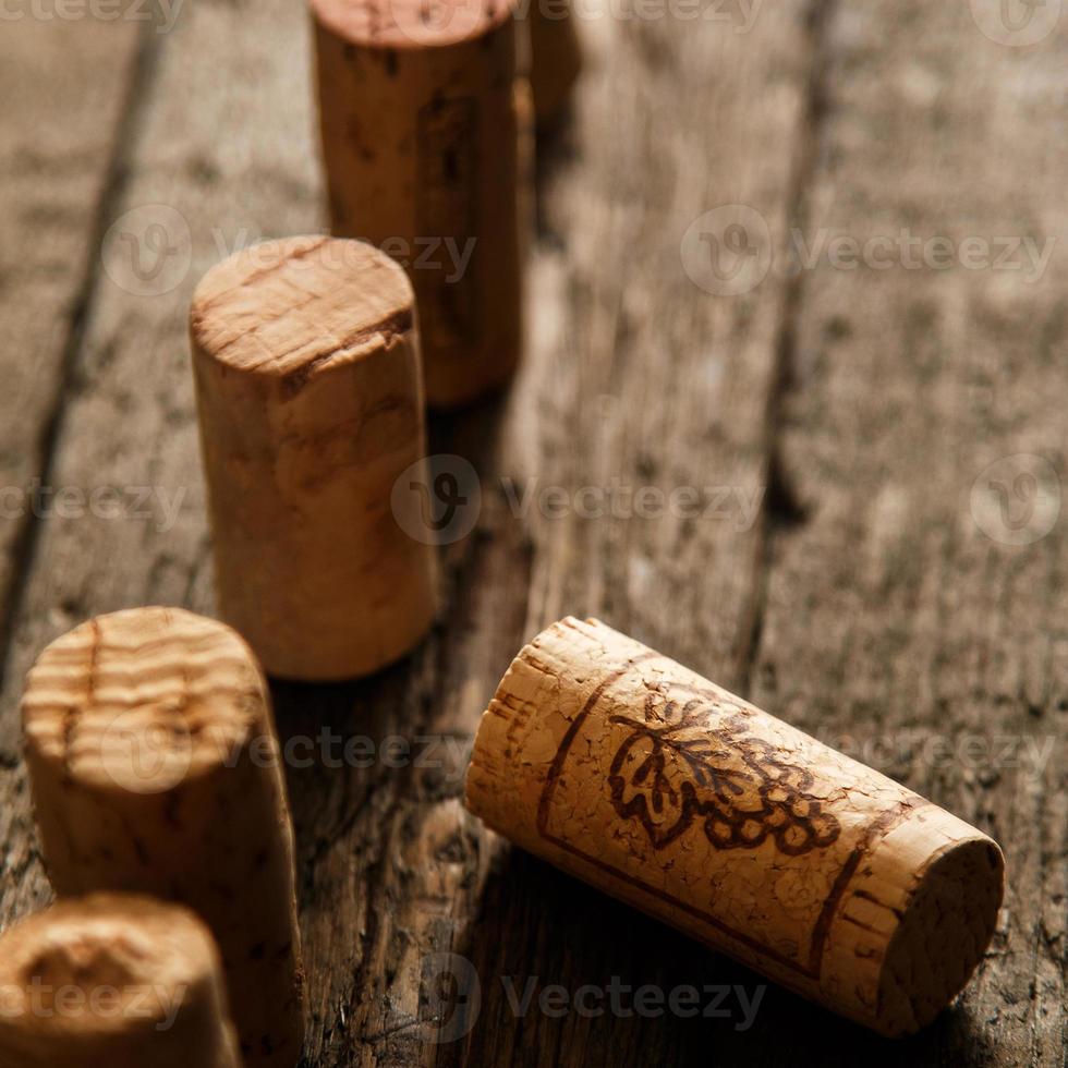 Wine corks on wooden background photo