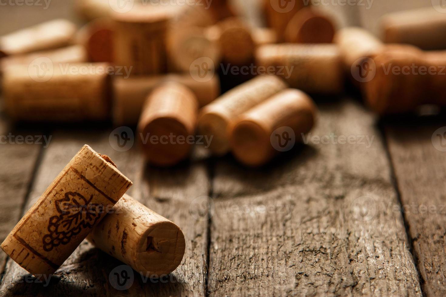 Wine corks on wooden background photo