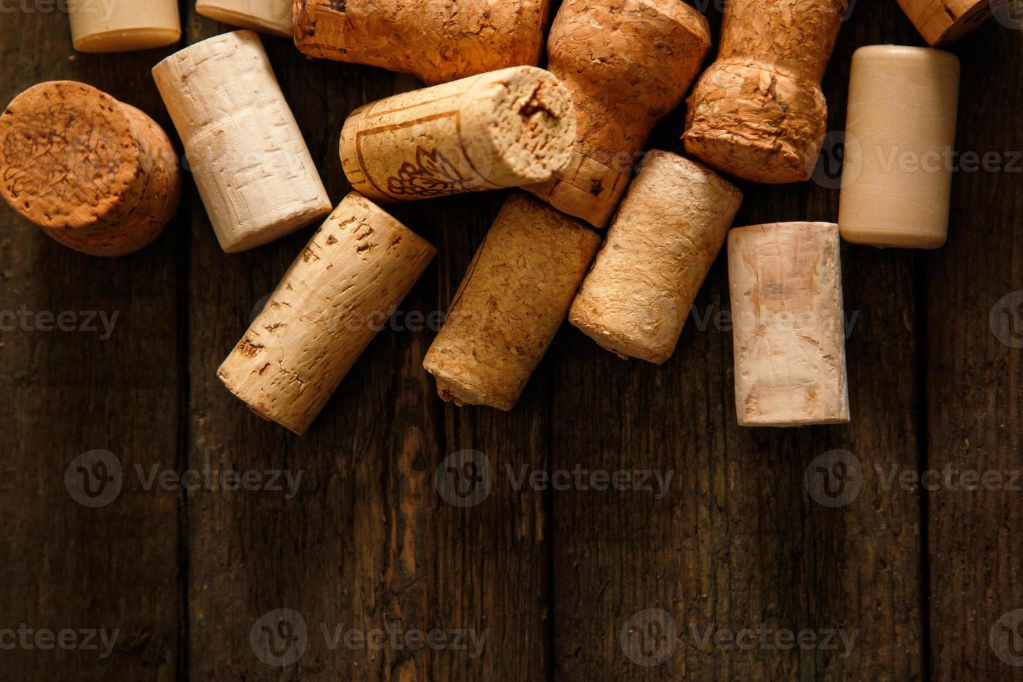 Wine corks on wooden background photo