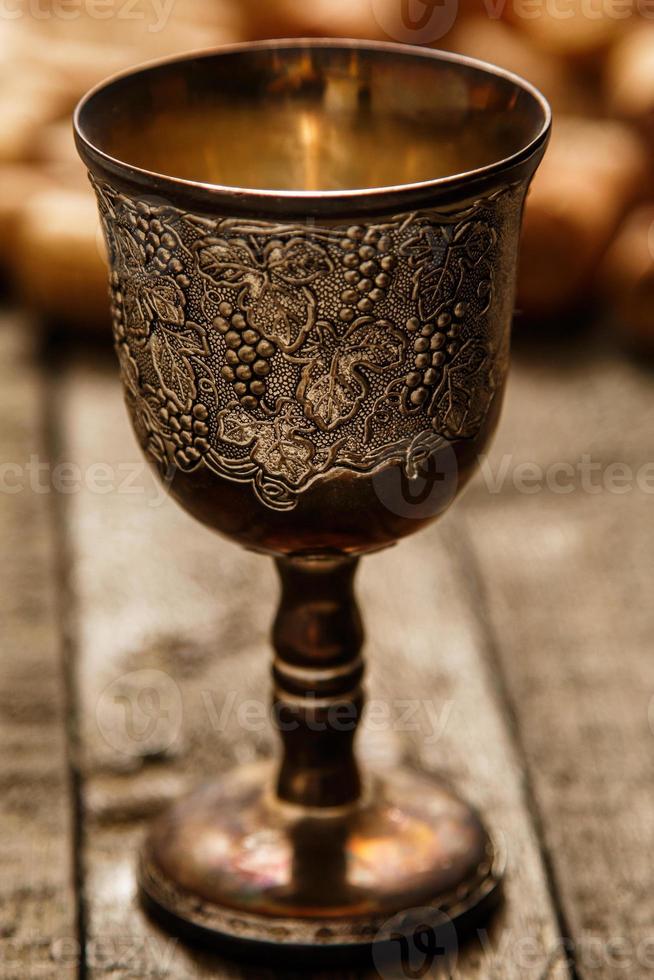 Medieval goblet and wine corks photo