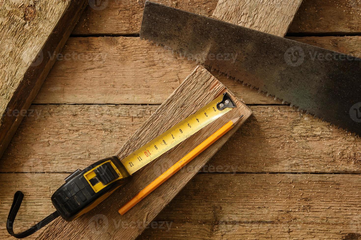 Carpentry tools on wooden surface photo