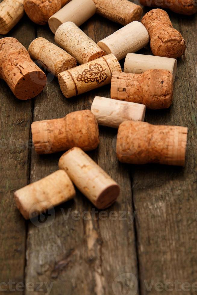 Wine corks on wooden background photo