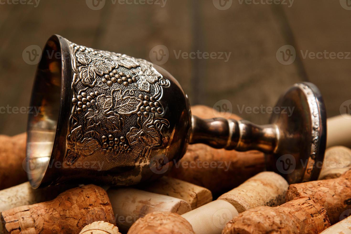 Medieval goblet and wine corks photo