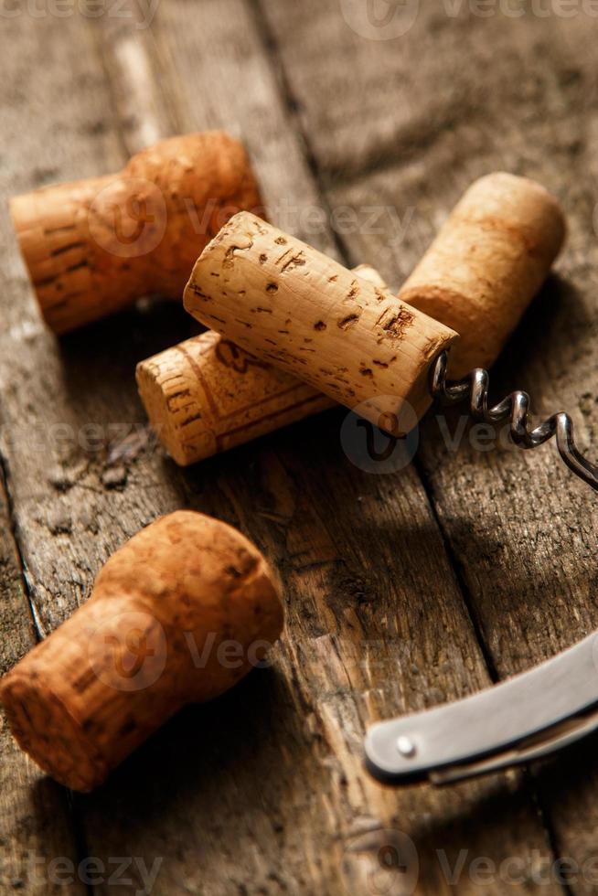 Corkscrew and wine corks photo