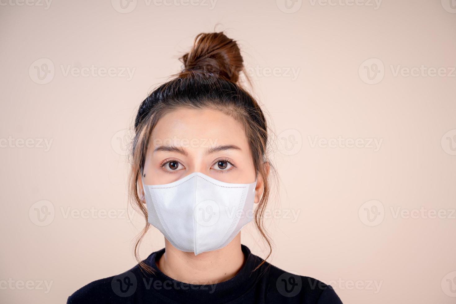 Woman wearing anti-virus mask to prevent others from contracting Corona COVID-19 and SARS cov 2. photo