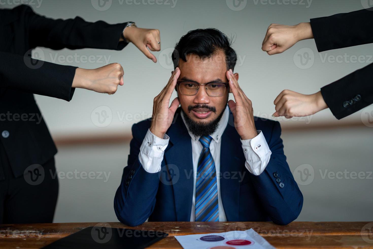 All your friends blame you. An anxious businessman was judged by many pointing to her. negative human emotions photo