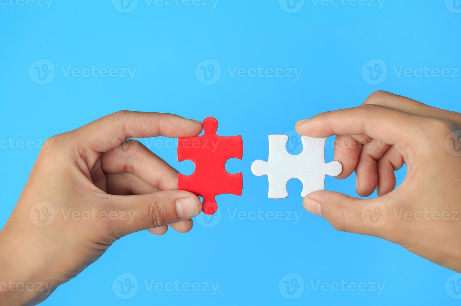 Closeup hand of man connecting jigsaw puzzle with sunlight effect, Business solutions, success and strategy concept photo