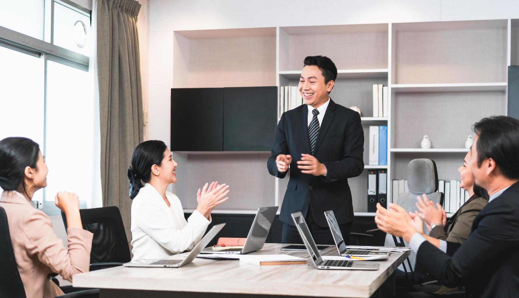 Group of coworkers in conference room during meeting, Business people in board room meeting at the office photo