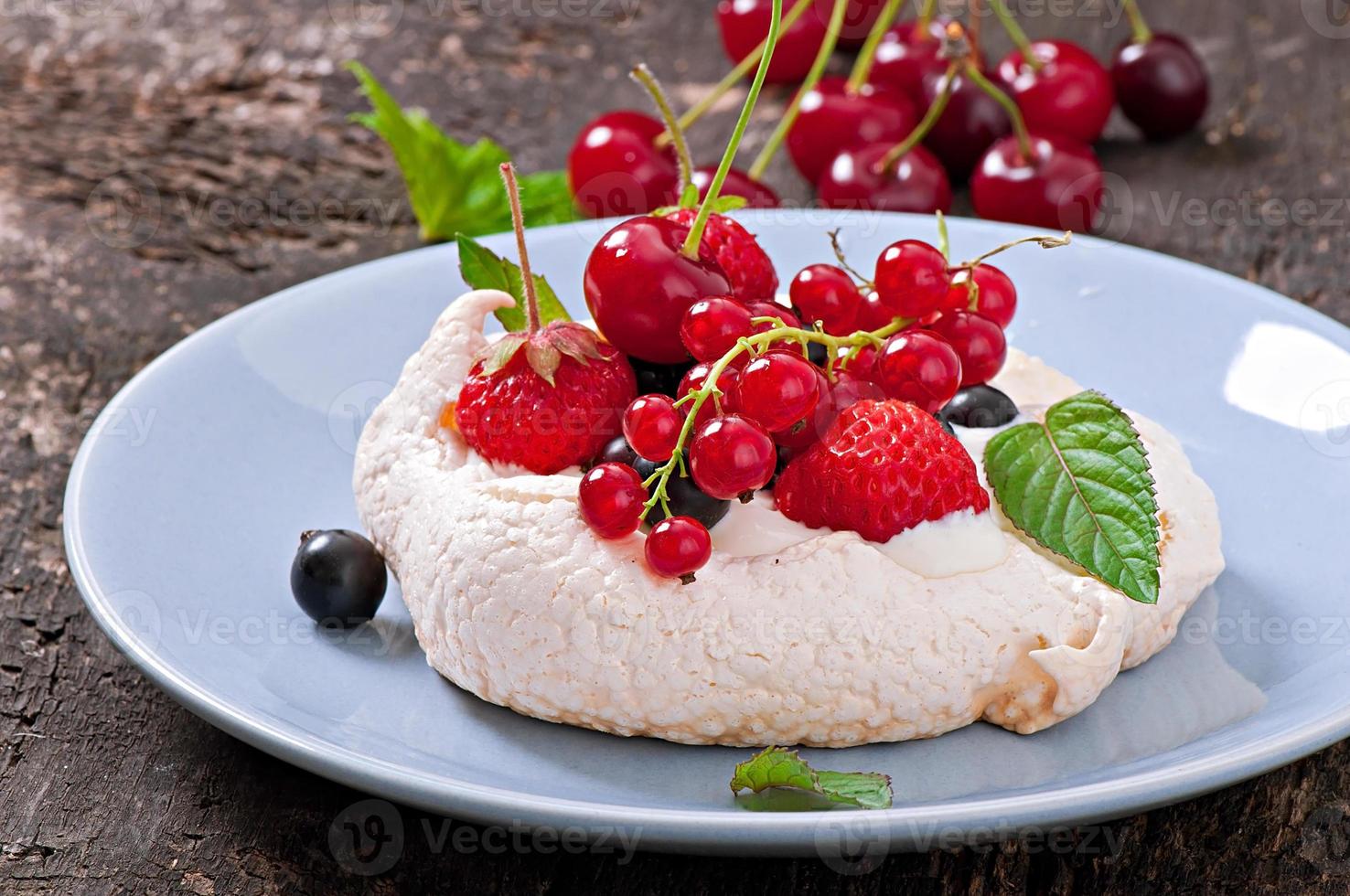 Cake Pavlova with cream and berries photo