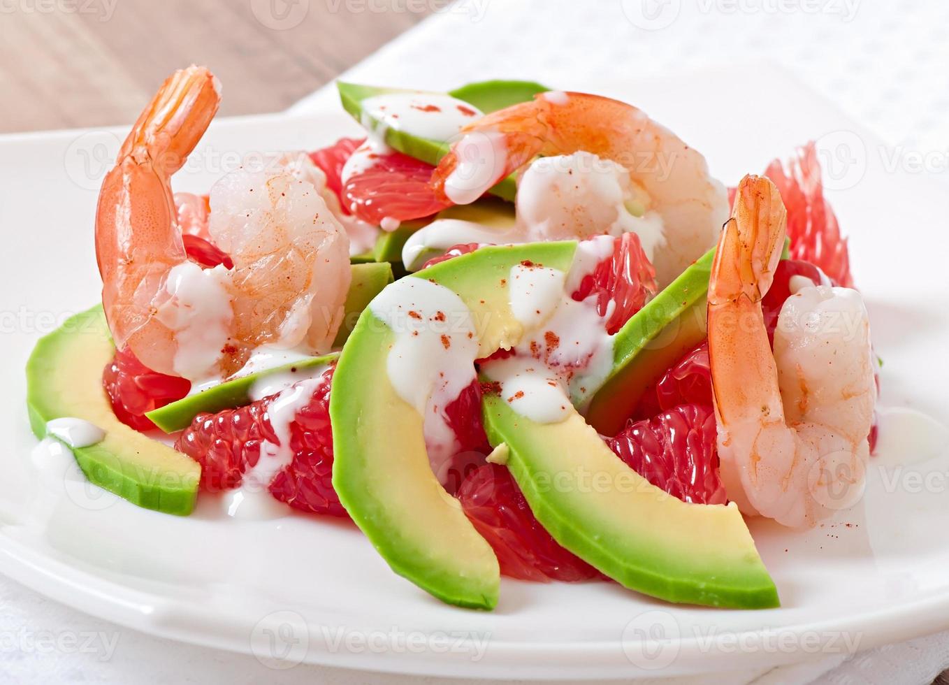 California salad - a mix of avocado, grapefruit and shrimp, seasoned with cayenne pepper yogurt photo