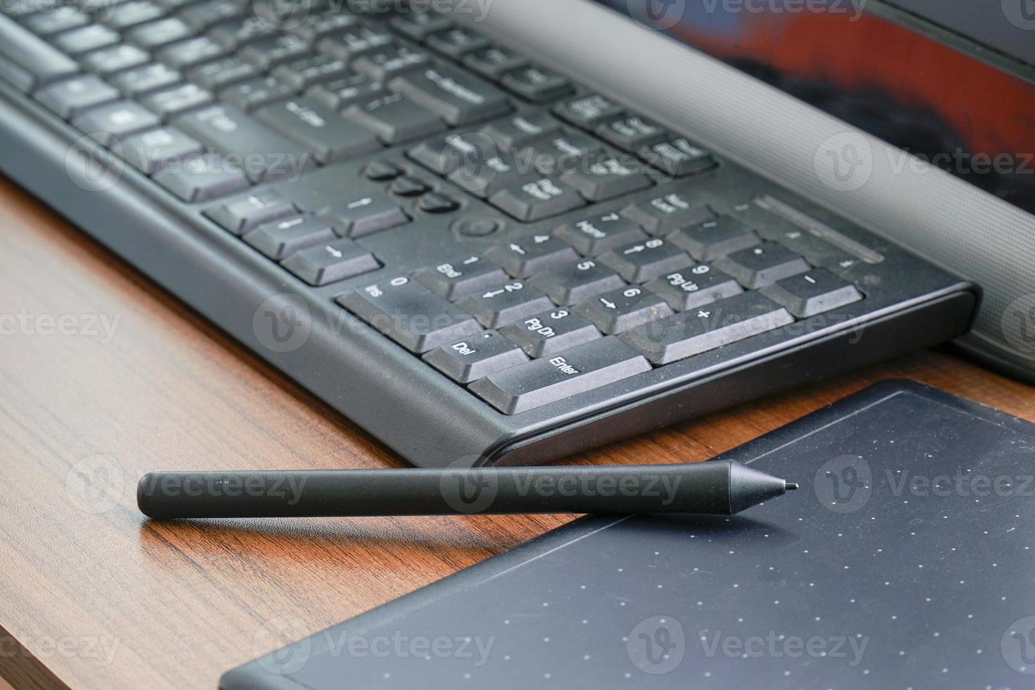 digital tablet with stylus pen on office desk photo
